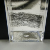 Steel wool particles in mineral oil